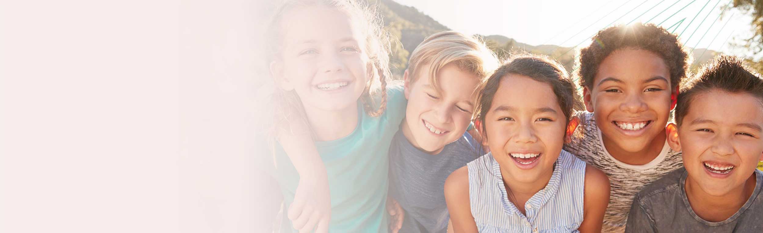 Portrait Of Multi-Cultural Children Hanging Out With Friends In